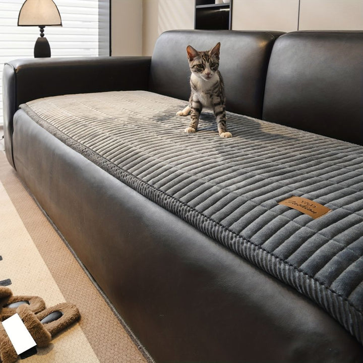cozy-quilted-couch-cover-protector-6246c5ef_0b700f98-4c4c-4976-b4b7-0ceb7e997dc8