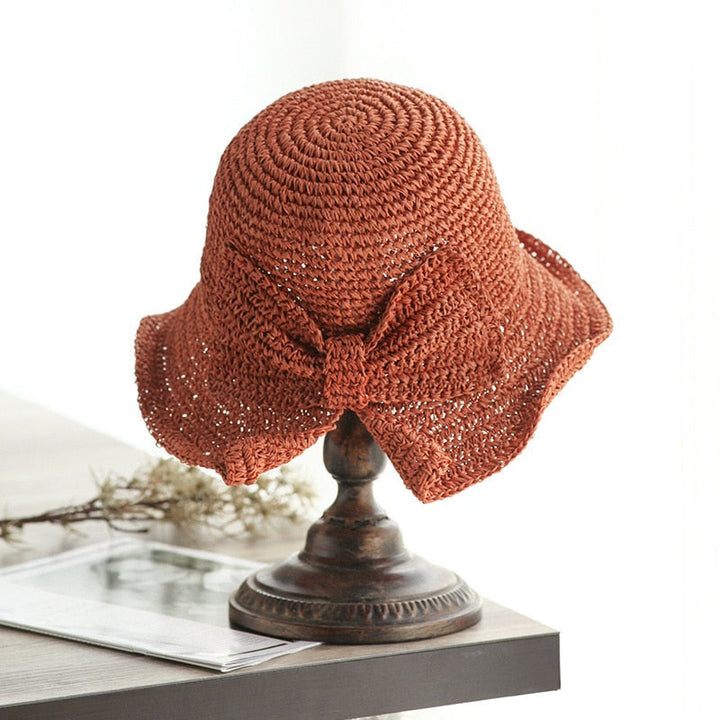 wide-brim-straw-hat-566ccada_03480da1-9dbe-44d6-a18c-8dfd479c95d1